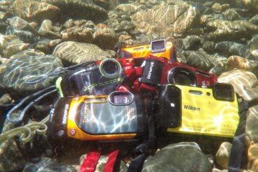 This image shows five of the best waterproof cameras underwater.