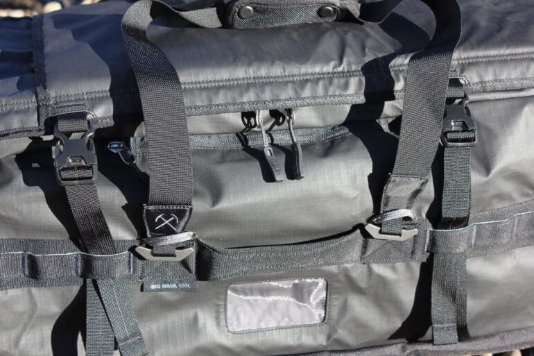 This image shows a close-up of the REI Co-op Big Haul 120 Duffel in black.