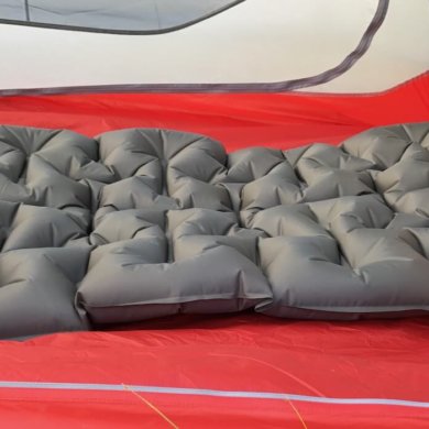 This image shows the Cabela's Ultralight Air Pad inside of a backpacking tent.