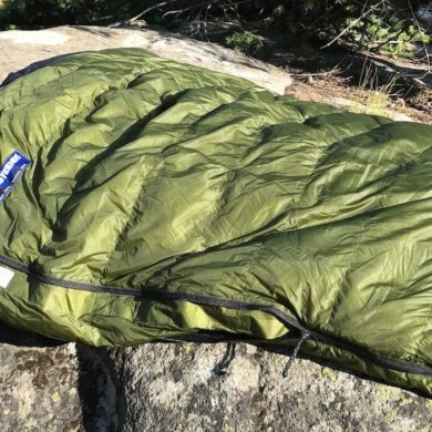 This image shows the Feathered Friends Flicker 20 Nano Down Quilt Sleeping Bag in the Eagle Cap Wilderness area.