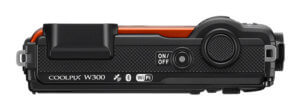 This image shows the top of the Nikon W300 waterproof camera.