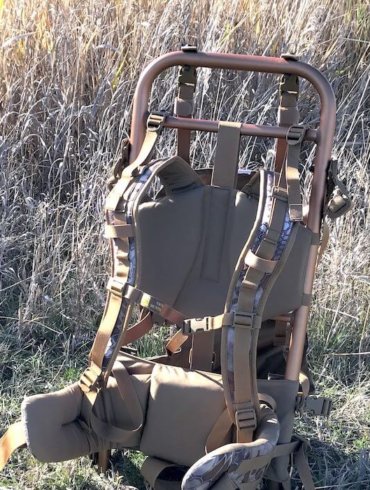 This image shows the SJK Rail Hauler 2.0 backpack in a field.