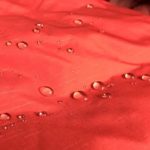 This image shows beads of water on the waterproof shell of the REI Co-op Stormhenge 850 Down Jacket.