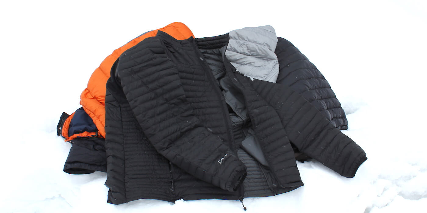 This image shows several down jackets, including an XL Tall Eddie Bauer DownLight StormDown Jacket.