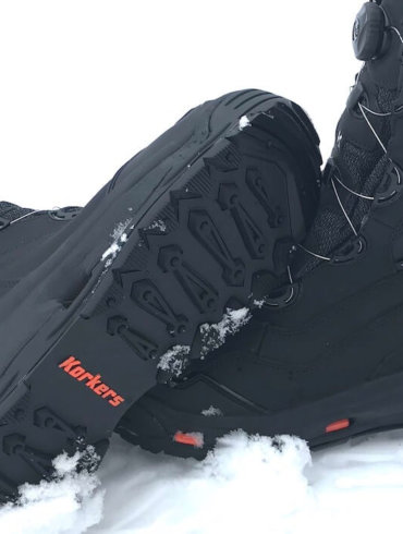 This image shows the Korkers Polar Vortex 600 winter boots in the snow.