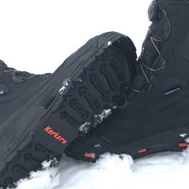 This image shows the Korkers Polar Vortex 600 winter boots in the snow.