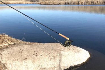 This image shows the Sage Foundation Outfit on a rock near a stream.