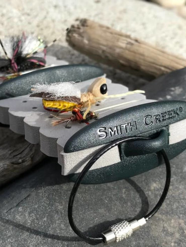 This photo shows the Smith Creek Rig Keeper fly fishing accessory on a rock.