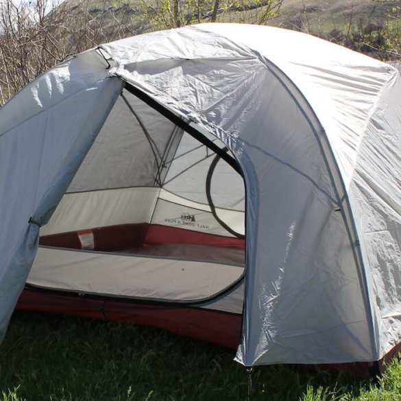 This photo shows the REI Co-op Half Dome 4 Plus Tent with one door open.