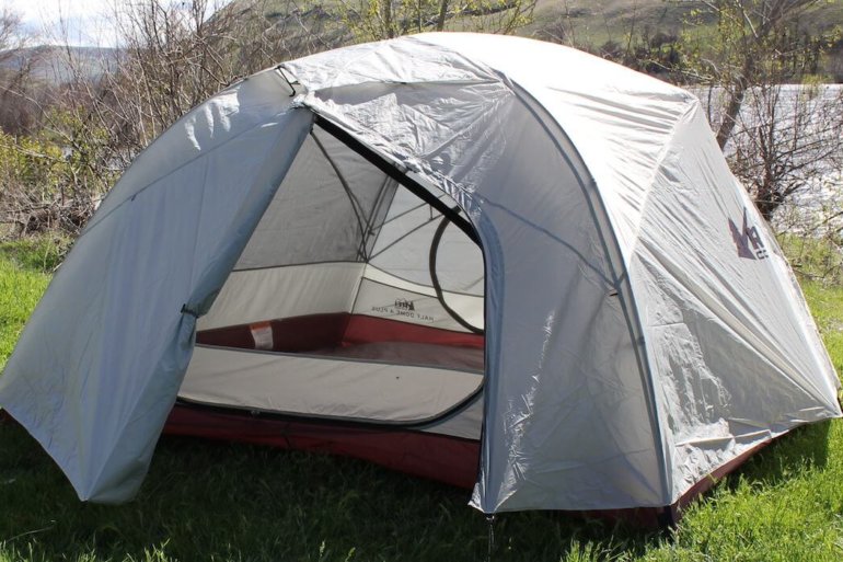 This photo shows the REI Co-op Half Dome 4 Plus Tent with one door open.