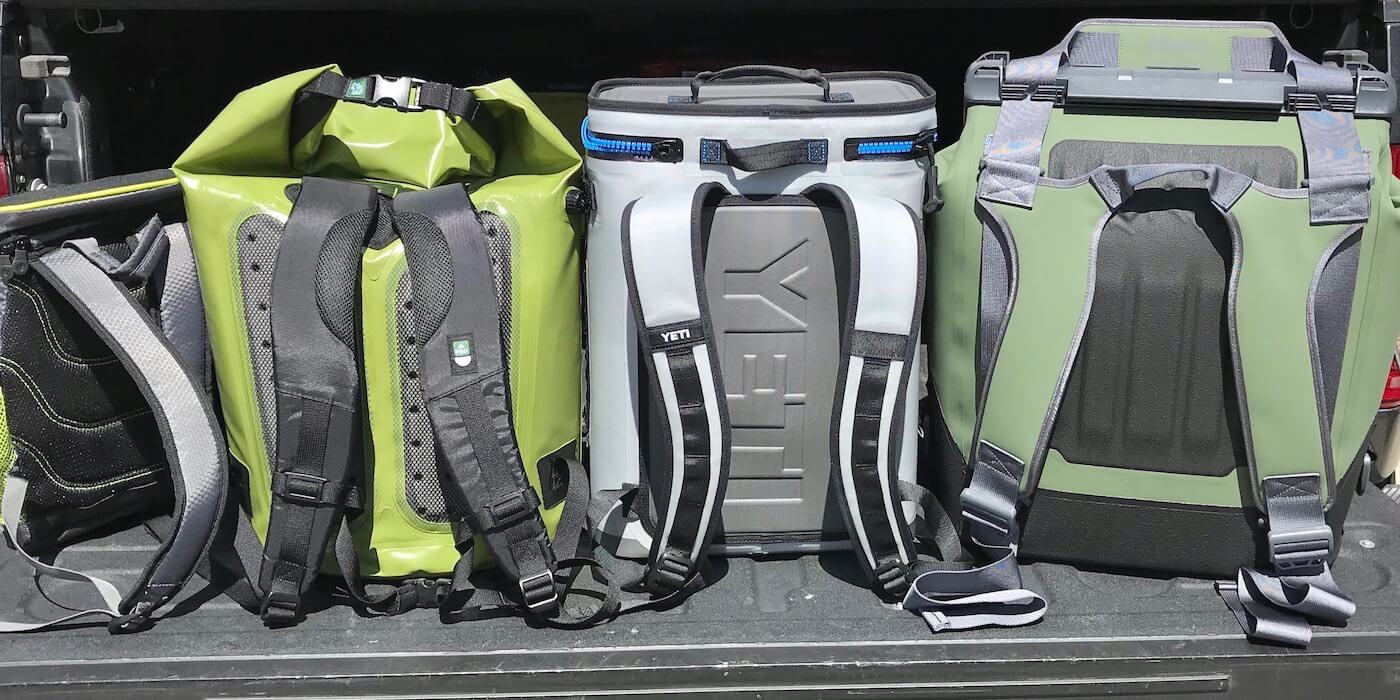 This photo shows several backpack coolers in a row, including the YETI Hopper BackFlip 24, OtterBox Trooper LT 30, and ICEMULE Pro.
