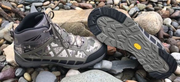 This photo shows the Cabela's Instinct Pursuitz hunting boots on rocks.