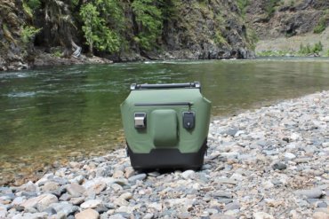 This photo shows the OtterBox Trooper LT 30 next to a river.