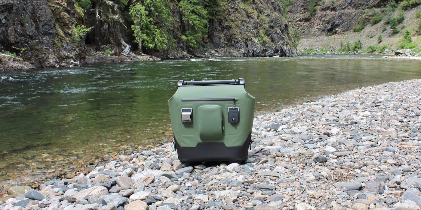 This photo shows the OtterBox Trooper LT 30 next to a river.