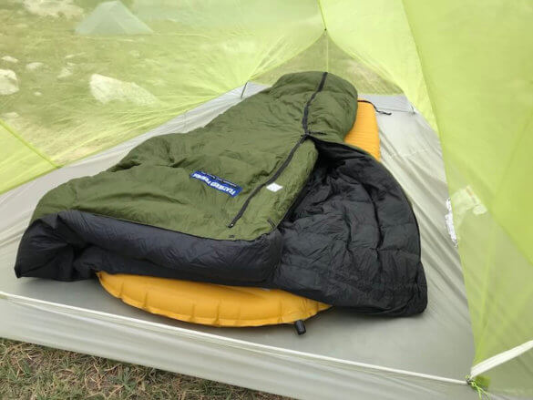 This photo shows the Big Agnes Fly Creek HV2 Platinum Tent interior with a backpacking sleeping pad and down sleeping bag.