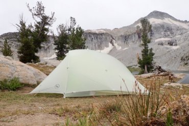 This photo shows the Big Agnes Fly Creek HV2 Platinum Tent set up near a mountain lake.