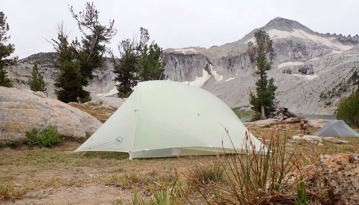 This photo shows the Big Agnes Fly Creek HV2 Platinum Tent set up near a mountain lake.
