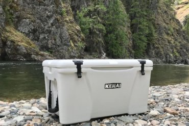 This photo shows the Grizzly Kenai 45 cooler on a river bank.