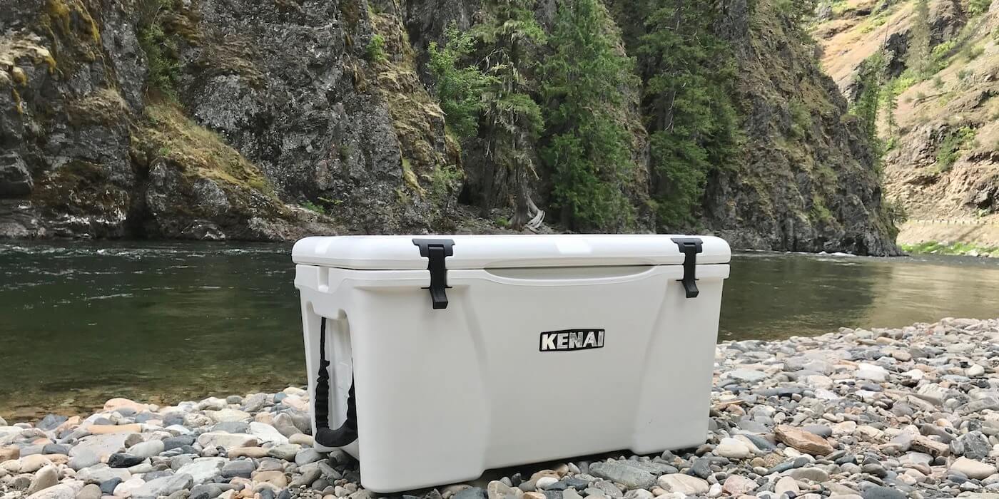 This photo shows the Grizzly Kenai 45 cooler on a river bank.