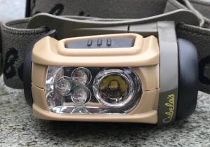 This best headlamp for hunting photo shows the Cabela's Alaskan Guide RGB Headlamp by Princeton Tec.