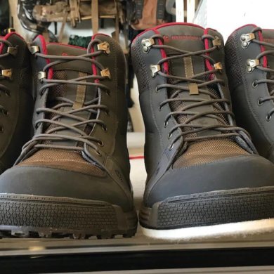 This photos shows the Redington Prowler Sticky Rubber Wading Boots next to the Redington Prowler Felt Wading Boots.