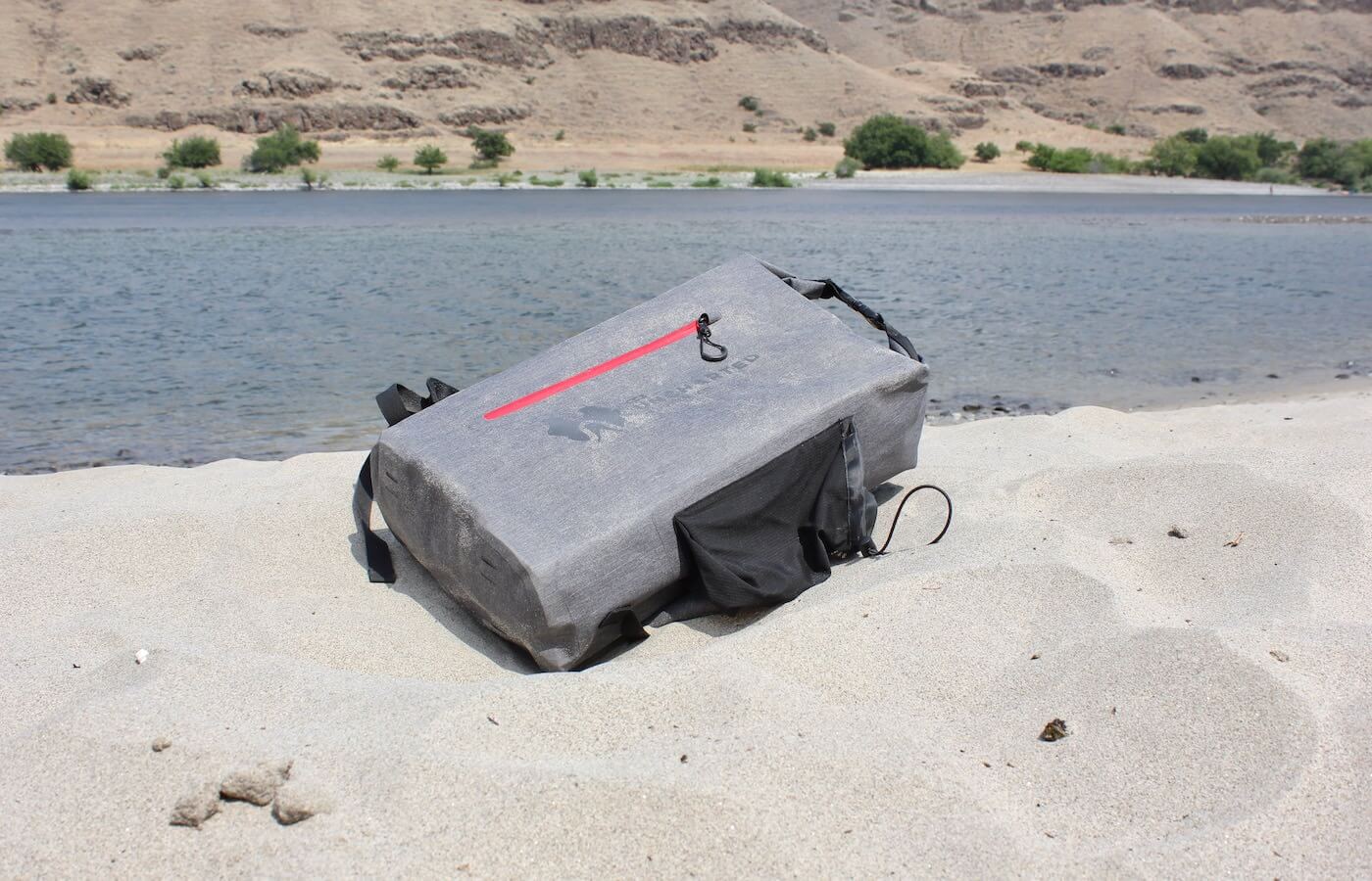 This photo shows the SEVENTY2 Survival System on a sandy beach.