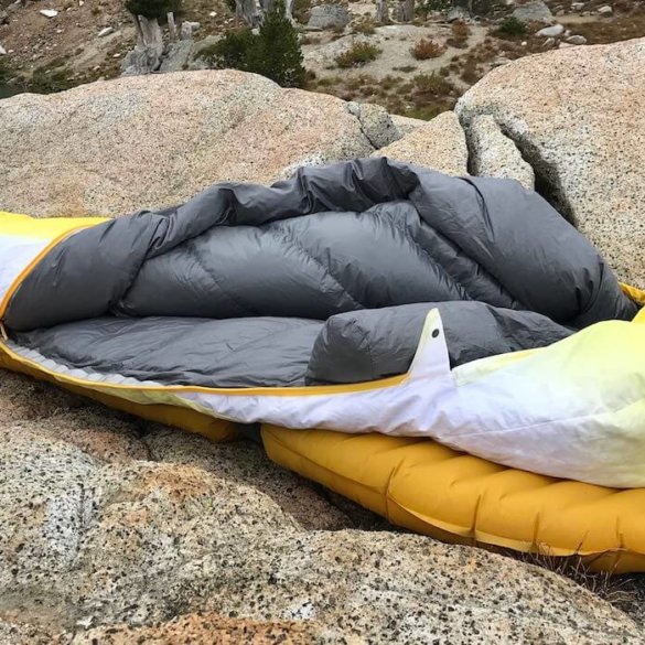 This photo shows the Therm-a-Rest Parsec 20 sleeping bag near a mountain lake.