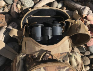 This photo shows the Alaska Guide Creations Classic MAX Pack Bino Harness with binoculars inside the pack.