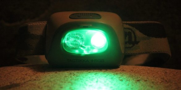 This photo shows the green light mode on the Petzl Tactikka + RGB Headlamp.
