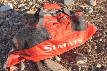 This photo shows the Simms Taco Wader Bag outside.