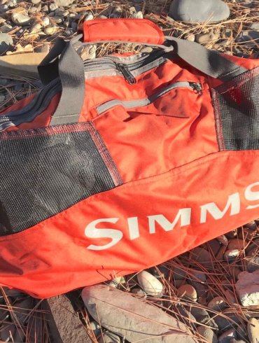 This photo shows the Simms Taco Wader Bag outside.