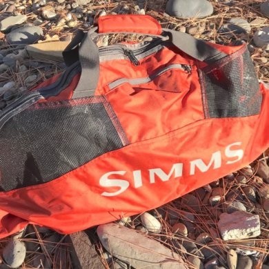 This photo shows the Simms Taco Wader Bag outside.