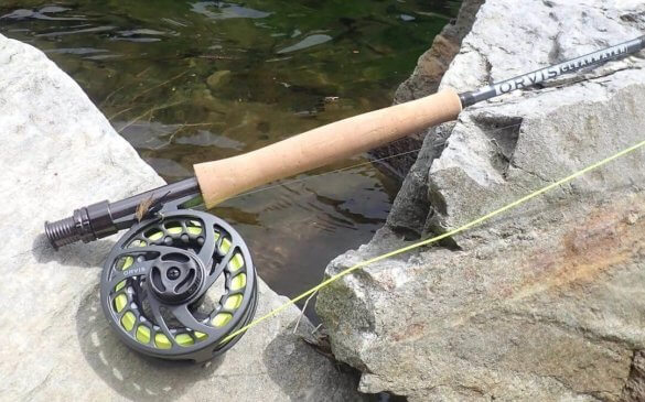 This photo shows the new Orvis Clearwater Fly Rod Outfit on a rock near a trout stream.