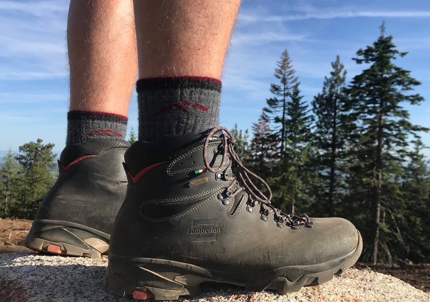 This Darn Tough sock review photo shows the Darn Tough Hiker Boot Sock Full Cushion Sock being worn by a hiker.
