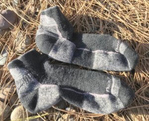 This photo shows a well-used pair of Darn Tough hiking socks.