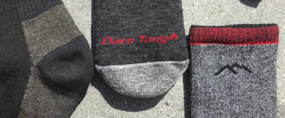 This photo shows the heel, toe and top of Darn Tough hiking socks in a closeup.