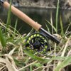Clearwater Fly Rod Outfit in the 9-foot 5-weight version on a grassy bank near a trout stream.