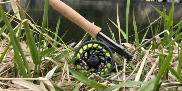 Clearwater Fly Rod Outfit in the 9-foot 5-weight version on a grassy bank near a trout stream.