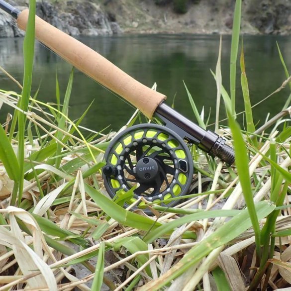 This photo shows the Orvis Clearwater Fly Outfit rod and reel near a river.