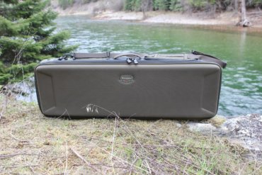 The review photo shows the Simms Bounty Hunter Vault Duffel outside near a river.