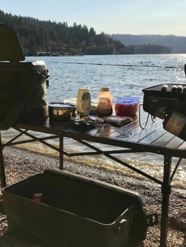 This photo shows the Mountain Summit Gear Heavy-Duty Roll-Top XL Table outside.