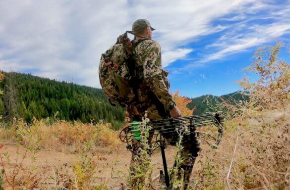 This photo shows a hunter wearing the Mystery Ranch Mule backpack outside.