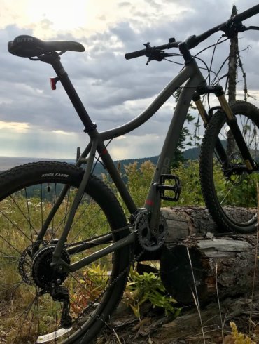 This review photo shows the REI Co-op Cycles DRT 1.2 mountain bike outside.