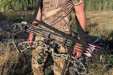 This photo shows a bowhunter wearing the Bow Buddy Bow Sling with a compound bow.