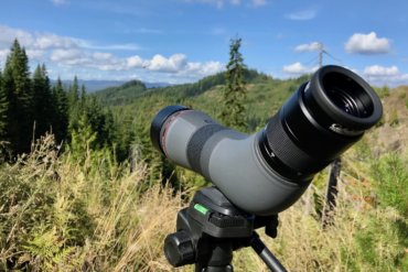 This photo shows the Cabela's CX Pro HD Spotting Scope outside in the woods on a tripod.