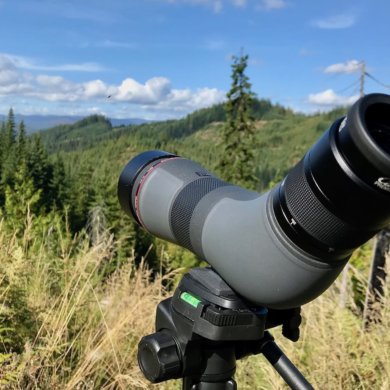 This photo shows the Cabela's CX Pro HD Spotting Scope outside in the woods on a tripod.