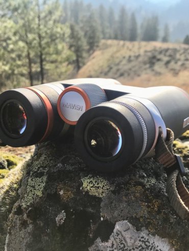 This photo shows the Maven B.1 Binoculars outside on a rock.