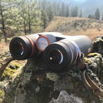 This photo shows the Maven B.1 Binoculars outside on a rock.
