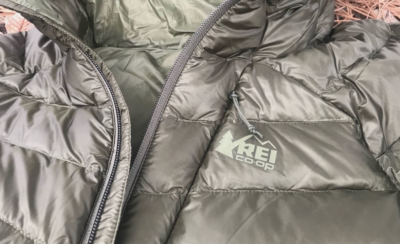This photo shows the REI Co-op Magma 850 Down Hoodie 2.0 men's down jacket in a closeup.