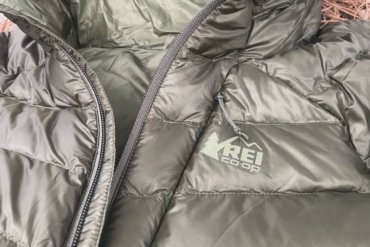 This photo shows the REI Co-op Magma 850 Down Hoodie 2.0 men's down jacket in a closeup.